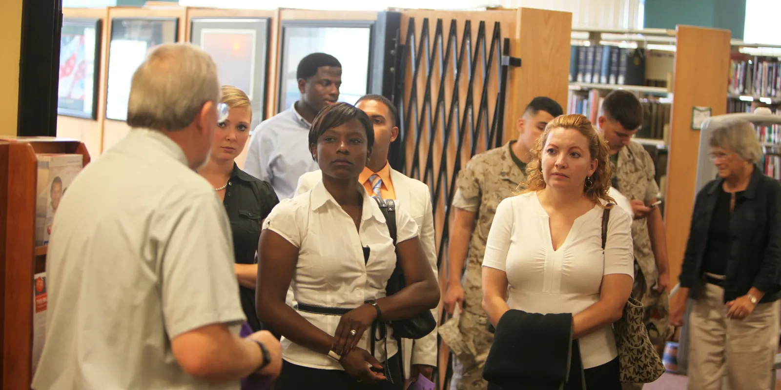 Women and Marines tour the library and transition resource center at Marine Corps Air Station Miramar